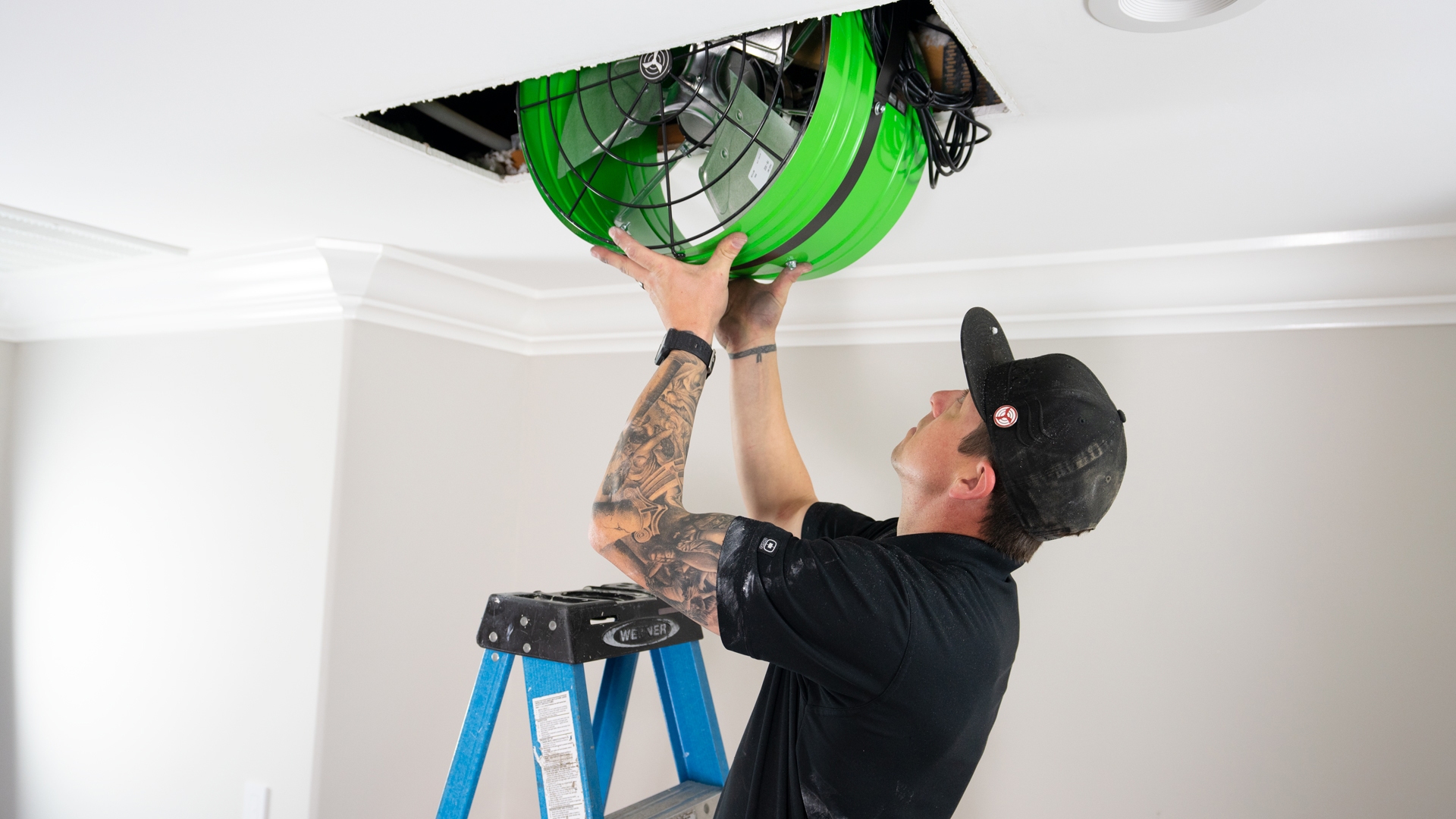 QC Worker is installing a Whole House Fan